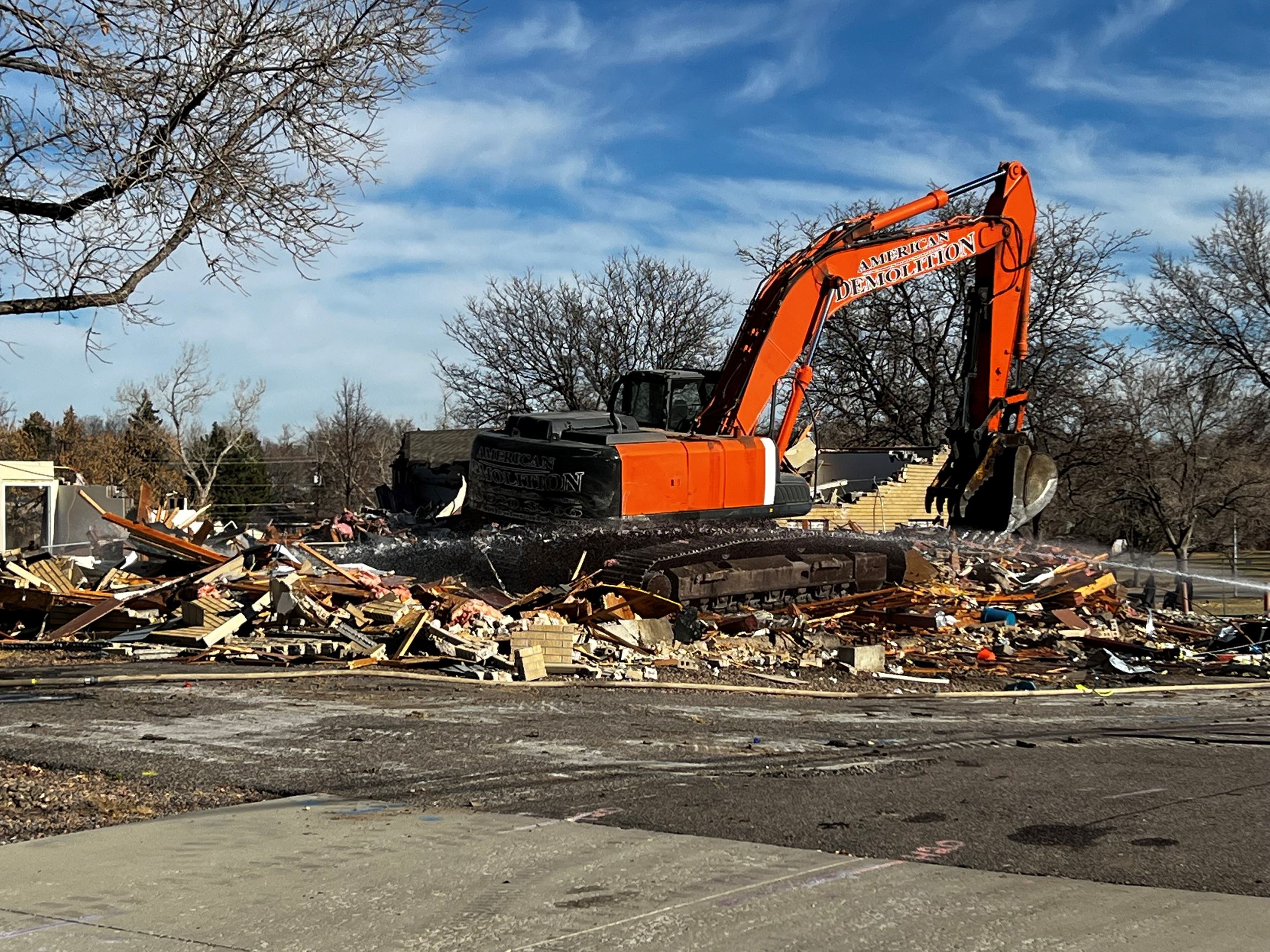 Photo of a crane and debris from demolition of Station 61