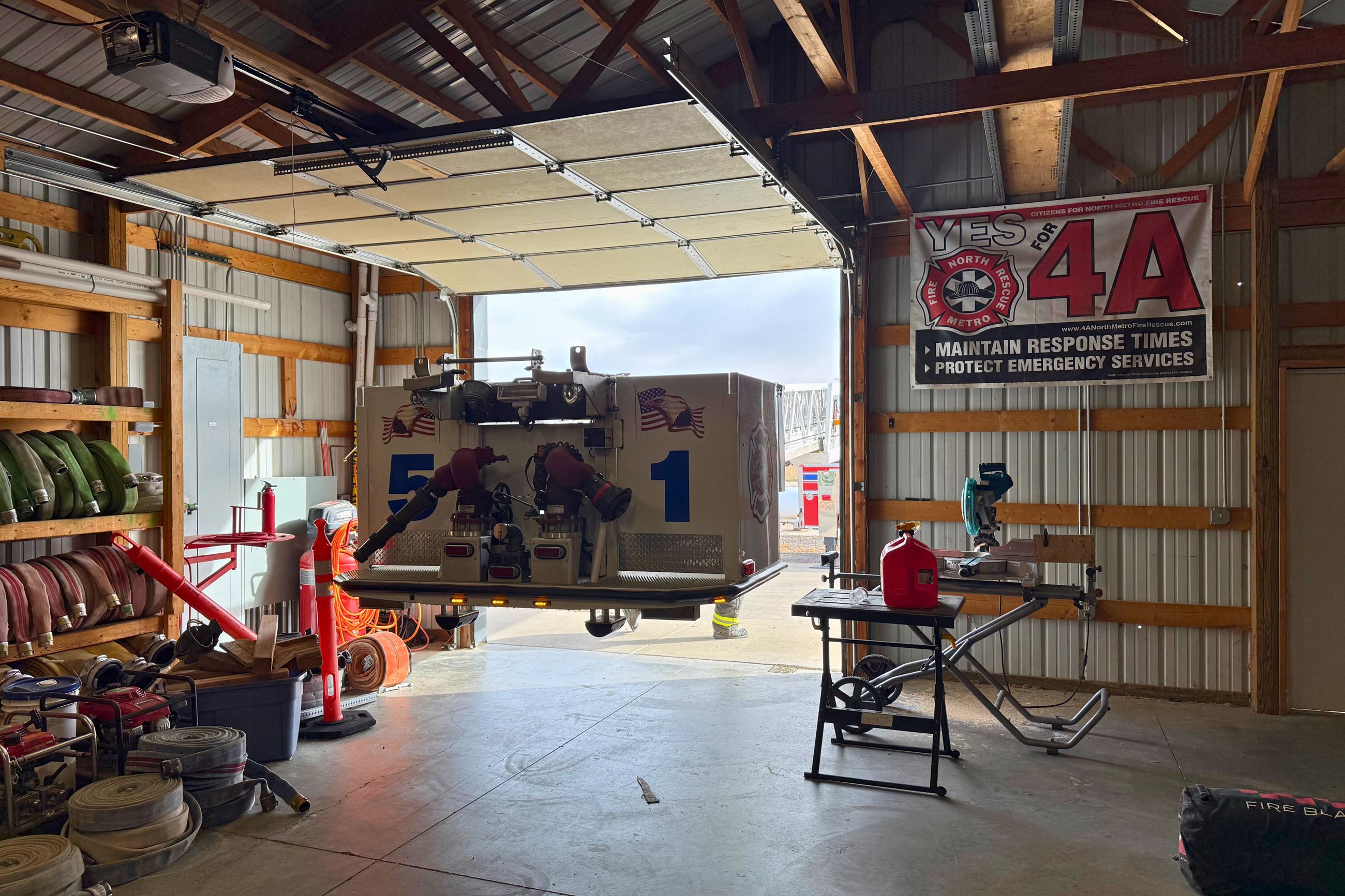 Basket of Tower 51 entering a structure through an open garage door